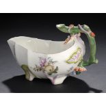 A CHELSEA PEACH SHAPED SAUCE BOAT, C1756-8  finely enamelled with flowers, 15.5cm l, red anchor ++