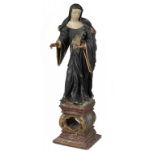 A CONTINENTAL POLYCHROMED LIMEWOOD FIGURE OF A FEMALE SAINT, 18TH C  78cm h ++Some restorations,