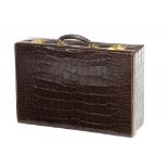 A FINE CROCODILE HIDE SUITCASE BY ASPREY & CO, C1930  with maker's gilt brass locks and stays,