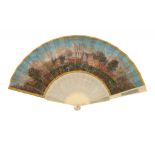 A FRENCH IVORY FAN, MID 19TH C the chicken skin leaf finely painted with a townscape, the reverse