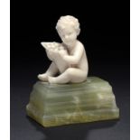 FERDINAND PREISS. AN IVORY FIGURE OF A BOY WITH FRUIT, C1930  on onyx base, 8cm h, engraved F PREISS