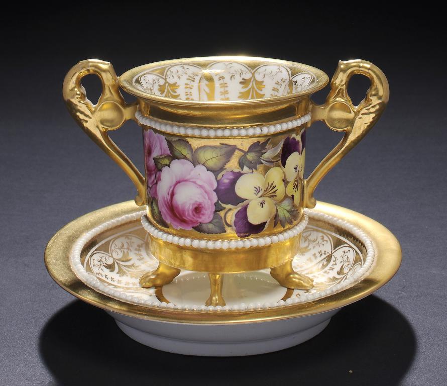 A DERBY GILT GROUND CABINET CUP AND SAUCER, C1820  the cup finely painted with continuous flowers,