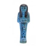 AN EGYPTIAN   BLUE GLAZED COMPOSITION  SHABTI, 19TH/20TH DYNASTY  inscribed for 'The Osiris, the