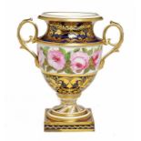 A DERBY SHIELD SHAPED COBALT GROUND TWO HANDLED VASE, C1825 painted with a continuous band of roses,