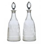 A PAIR OF VICTORIAN GLASS DECANTERS AND STOPPERS  engraved with a shield bearing initials EJ between