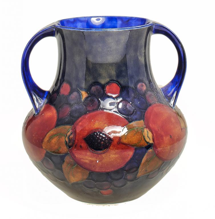 A MOORCROFT POMEGRANATE VASE DESIGNED BY WILLIAM MOORCROFT, C1920 20cm h, impressed mark, painted