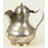 A CONTINENTAL ARTS & CRAFTS SILVER JUG WITH DOMED LID, CIRCA 1900