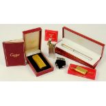 A CARTIER GOLD PLATED CIGARETTE LIGHTER, BOXED AND VARIOUS ACCESSORIES, A DUNHILL SILVER PLATED