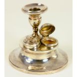 AN UNUSUAL GEORGE V SILVER DESK CANDLESTICK OF CAPSTAN FORM, THE BASE SET WITH TWO LIDDED