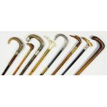 EIGHT VARIOUS VICTORIAN AND LATER SILVER MOUNTED AND OTHER WALKING CANES, ONE WITH CARVED MOTHER