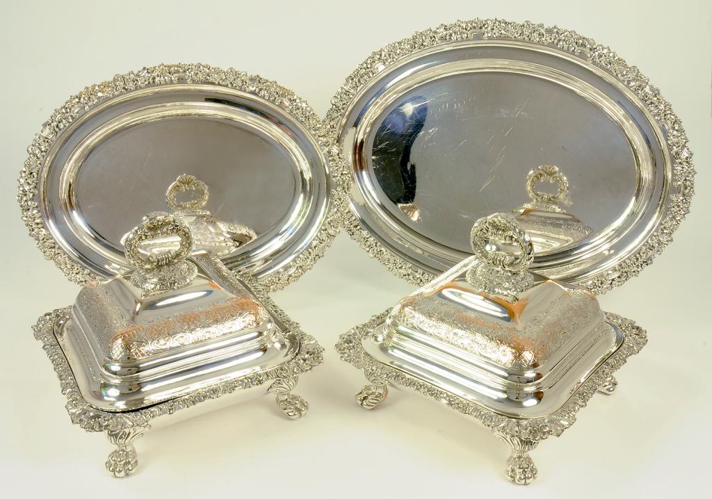A PAIR OF EPNS SHAPED SQUARE ENTREE DISHES AND COVERS AND A GRADUATED PAIR OF SIMILAR OVAL DISHES