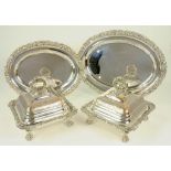 A PAIR OF EPNS SHAPED SQUARE ENTREE DISHES AND COVERS AND A GRADUATED PAIR OF SIMILAR OVAL DISHES