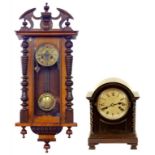 A WALNUT 'VIENNA' WALL CLOCK WITH GRIDIRON PENDULUM AND AN OAK MANTLE CLOCK, BOTH EARLY 20TH