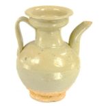 A CHINESE EARTHENWARE GLOBULAR EWER, SONG DYNASTY  with short incurved neck and spout, covered in