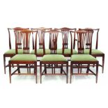 A SET OF SEVEN EDWARDIAN MAHOGANY DINING CHAIRS IN CHIPPENDALE STYLE WITH PIERCED SPLAT AND DROP