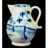 A LOWESTOFT SPARROW BEAK JUG, C1780 painted in underglaze blue with bamboo, peony and a fence, 7.5cm