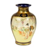 A JAPANESE SATSUMA WARE BLUE GROUND EARTHENWARE VASE, MEIJI  enamelled to either side with groups of