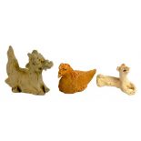 THREE CHINESE EARTHENWARE ANIMAL SCULPTURES  comprising a model of a recumbent hound, Song
