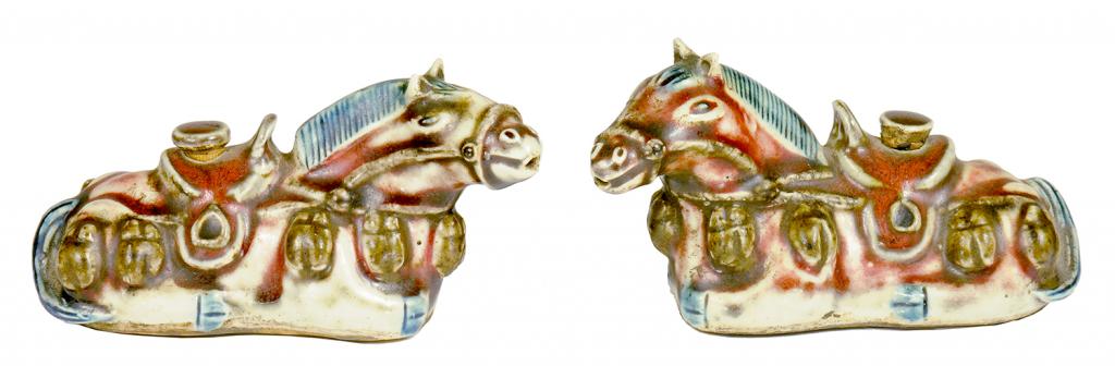 A PAIR OF CHINESE PORCELAIN WATER DROPPERS AND STOPPERS IN THE FORM OF RECUMBENT HORSES, QING