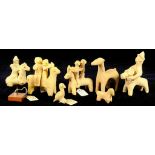 TWO SYRO-HITTITE TERRACOTTA GROUPS OF TWO FIGURES RIDING ON A DONKEY AND FIVE OTHER ANIMAL MODELS,