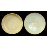 A CHINESE WHITE GLAZED PORCELAIN FOOTED DISH  with central moulded square inscription, probably 18th