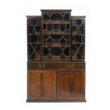 A VICTORIAN MAHOGANY BOOKCASE, LATE 19TH CENTURY the breakfront upper section fitted with adjustable