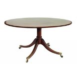 A MAHOGANY BREAKFAST TABLE THE OVAL TOP ON TURNED PILLAR AND QUADRUPLE REEDED LEGS