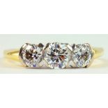 A DIAMOND THREE STONE RING WITH ROUND BRILLIANT CUT DIAMONDS IN 18CT GOLD, 4.3G GROSS