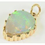 A HEART SHAPED OPAL PENDANT IN GOLD, 2.1G GROSS