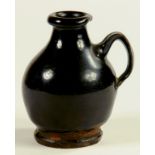 AN ENGLISH MANGANESE GLAZED BROWN STONEWARE JUG, EARLY 18TH C  10.5cm h, (excavated in Derby;