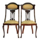 A PAIR OF EDWARDIAN CARVED MAHOGANY SALON CHAIRS