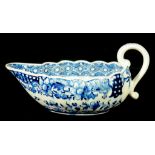 A DERBY LOW FLUTED SAUCE BOAT, C1780  painted in underglaze blue with a Chinese river scene and cell