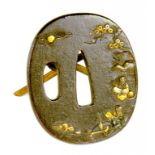 A JAPANESE IRON, SHIBUICHI AND SHAKUDO TSUBA, MEIJI 5.5cm h, later hinged strut (ex Portobello