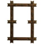 A VICTORIAN WOODEN 'TRAMP WORK' PICTURE FRAME