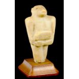 A SUMERIAN CARVED STONE FIGURE OF A MONSTER OF, POSSIBLY, MAGNESITE, C3500-3000BC  8.5cm h (ex