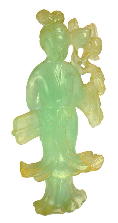 A CHINESE SEA GREEN FLUORSPAR CARVING OF A MAIDEN HOLDING A PEACH BOUGH, LATE 19TH/EARLY 20TH C 19cm