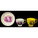 A SUNDERLAND YELLOW GLAZED EARTHENWARE CUP WITH BROWN ENAMEL RIM AND HANDLE AND A SIMILAR CUP AND