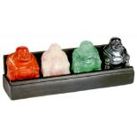 A SET OF FOUR CHINESE HARDSTONE CARVINGS OF HOTEI, LATE 20TH C  of rose quartz, fluorite, hematite