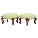 A PAIR OF VICTORIAN WALNUT FOOTSTOOLS