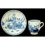 A LOWESTOFT COFFEE CUP AND SAUCER, C1790 painted in underglaze blue with a Chinese river scene,