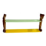 A UNUSUAL GREEN PAINTED WOODEN SHELF SUPPORTED BY A LONG PAIR OF LEATHER BOOTS