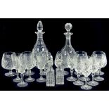 A SMALL QUANTITY OF CUT GLASS PRINCIPALLY DRINKING GLASS TO INCLUDE TWO DECANTERS AND STOPPERS