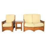 A RATTAN ARMCHAIR, SOFA AND OCCASIONAL TABLE
