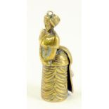 A LATE 19TH CENTURY BRASS NOVELTY FIGURAL CIGAR CUTTER IN THE FORM OF A FASHIONABLE LADY IN A BUSTLE