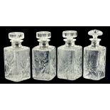 ONE AND SET OF THREE ELIZABETH II SILVER MOUNTED CUT GLASS SPIRIT DECANTERS AND STOPPERS