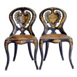 A PAIR OF VICTORIAN PAPIER MACHE CHAIRS INLAID WITH MOTHER OF PEARL AND GILT