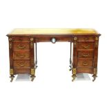 AN EMPIRE STYLE MAHOGANY DESK WITH BRASS MOUNTS, AN OVAL JASPER WARE MEDALLION TO THE CENTRAL