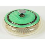 A METAL AND GREEN GUILLOCHE ENAMEL MOUNTED CUT GLASS POWDER BOWL AND COVER