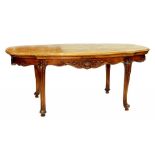 A FRENCH CARVED WALNUT DINING TABLE WITH SHAPED PARQUETRY TOP