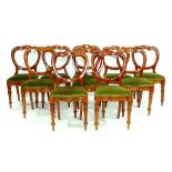 A SET OF TEN VICTORIAN MAHOGANY BALLOON BACK DINING CHAIRS